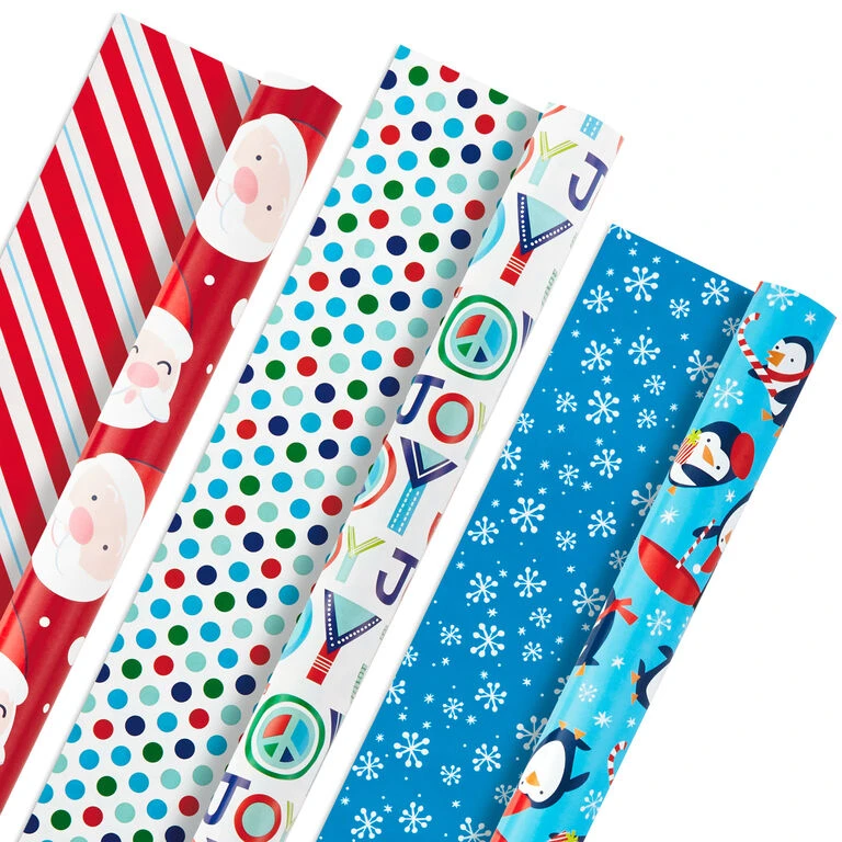 Hallmark Bright Joy 3-Pack Kids Reversible Christmas Wrapping Paper Assortment, 120 Sq. Ft. 3 Hallmark Bright Joy 3-Pack Kids Reversible Christmas Wrapping Paper Assortment, 120 Sq. Ft.