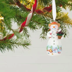 Hallmark Snowtop Lodge Terran S. Gardner Porcelain Ornament 9 Hallmark Snowtop Lodge Terran S. Gardner Porcelain Ornament -Hallmark Sales Store Snowman with Flower Pot Keepsake Ornament 2299QXR8119 02